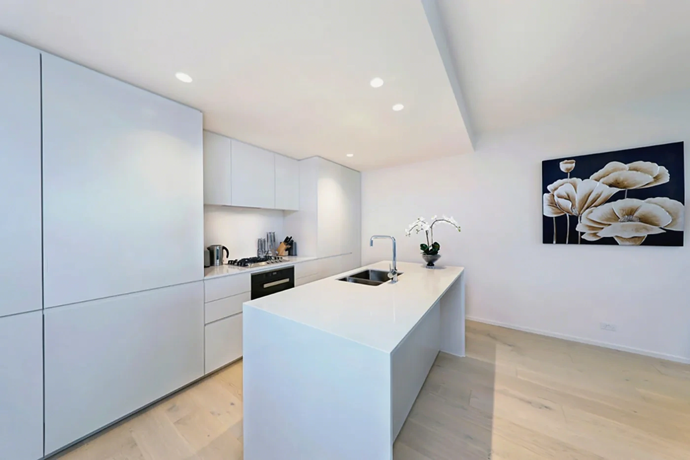 Designer stone kitchen with island bench in the Armadale residence