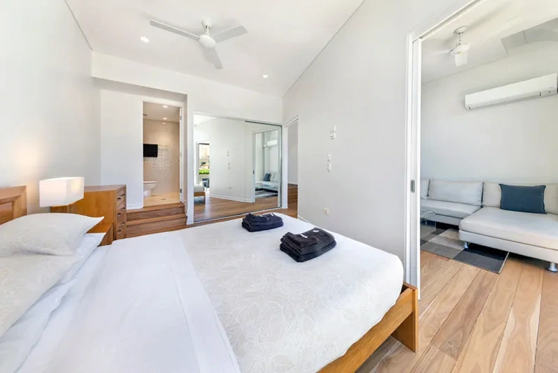 Master bedroom with timber floors, ensuite and sitting area, Balmain residence