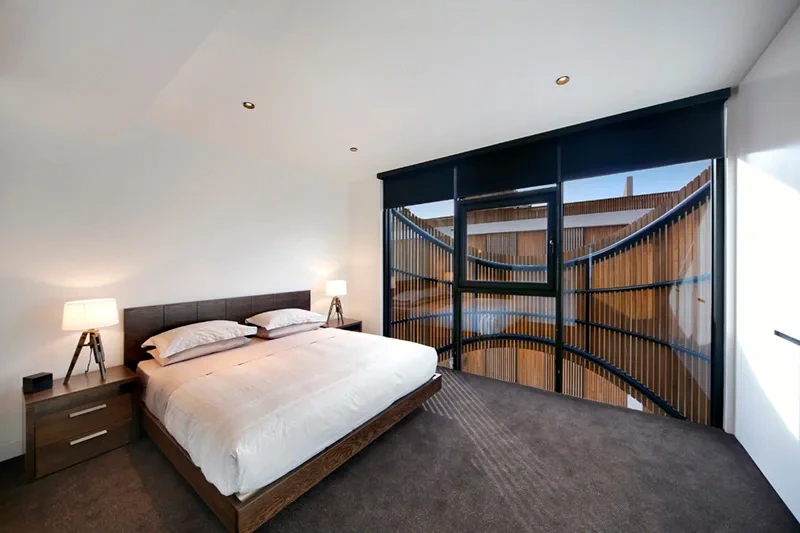 Furnished master bedroom with built-in wardrobes