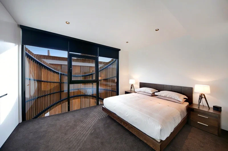 Furnished master bedroom with built-in wardrobes