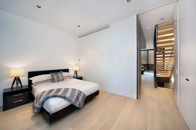 Second bedroom with built-in wardrobes and natural light
