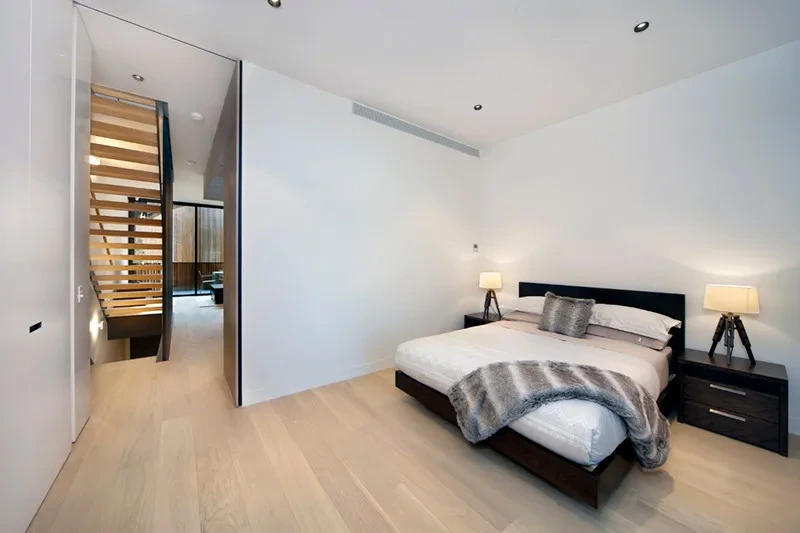 Second bedroom with built-in wardrobes and natural light