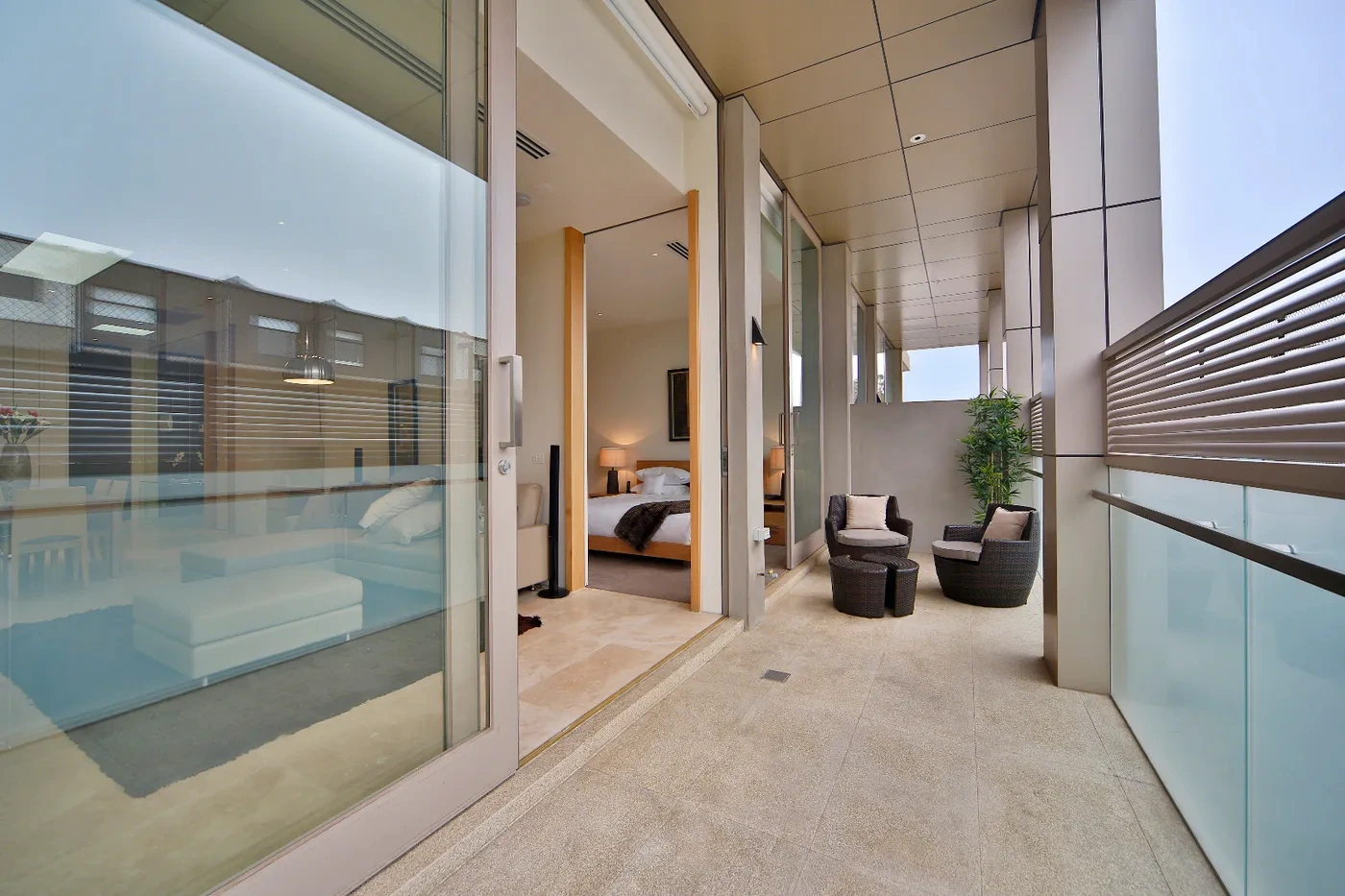 Covered balcony with glass balustrade at a Westprecinct serviced residence in Brighton