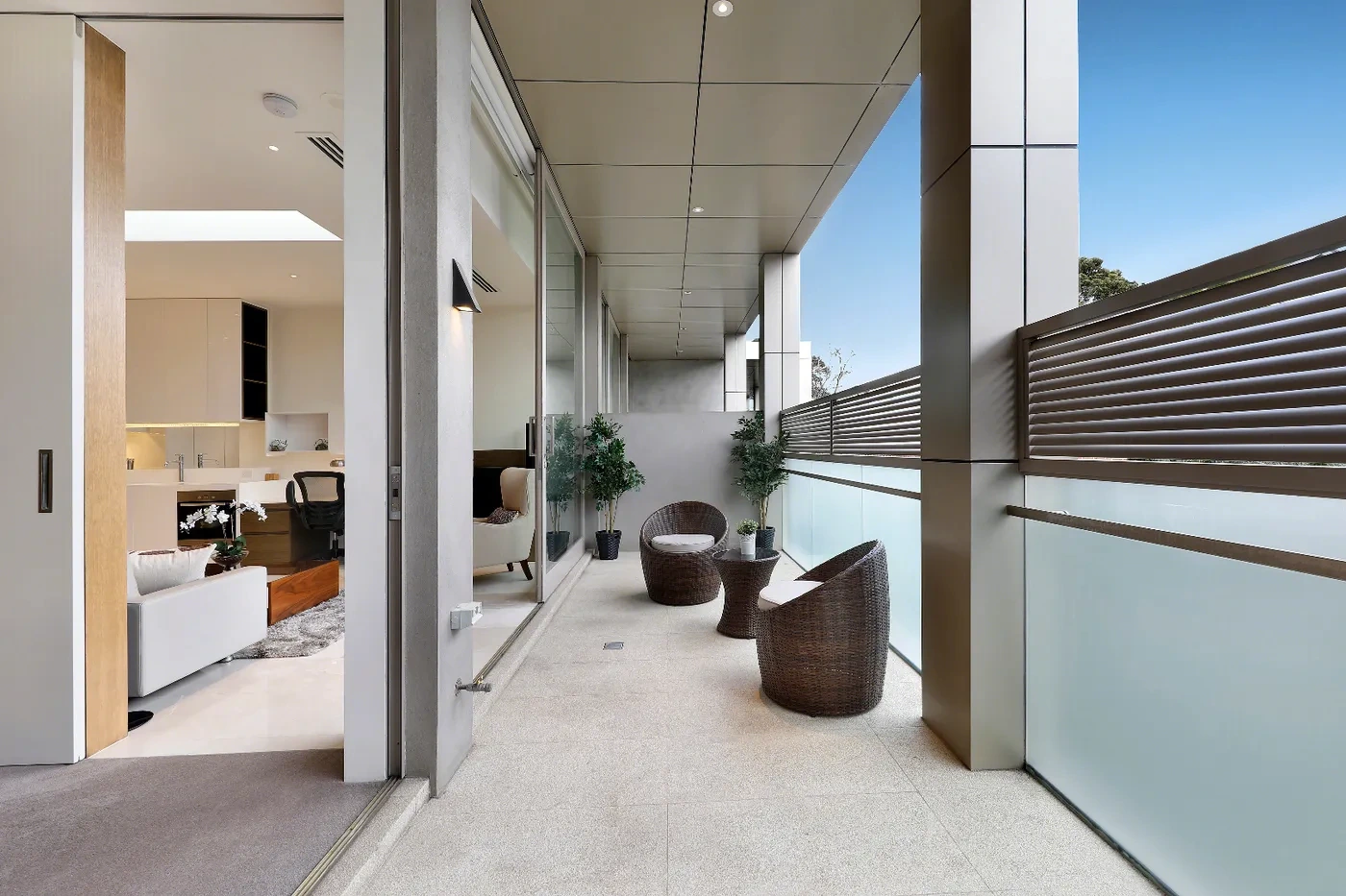 Covered balcony with outdoor seating at a Westprecinct serviced residence in Brighton