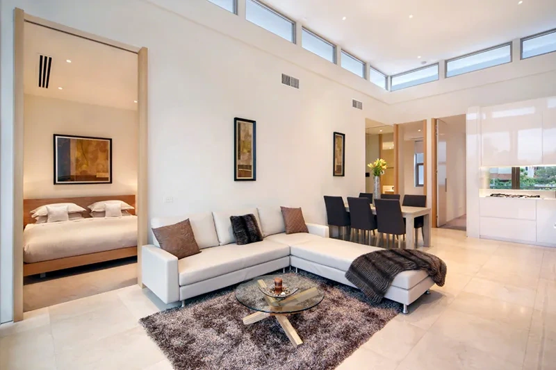 Living flowing to the dining area in the Brighton penthouse