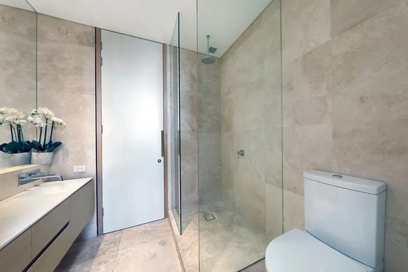 Stone bathroom in the Brighton corner penthouse