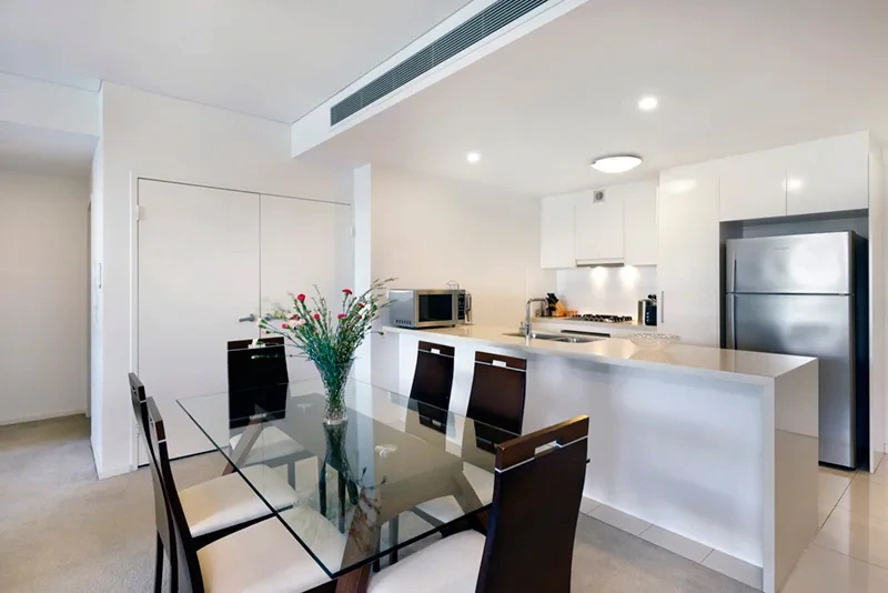 Open-plan dining area beside the living room in Breakfast Point
