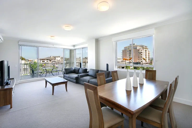 Open-plan living and dining in the Breakfast Point sub-penthouse