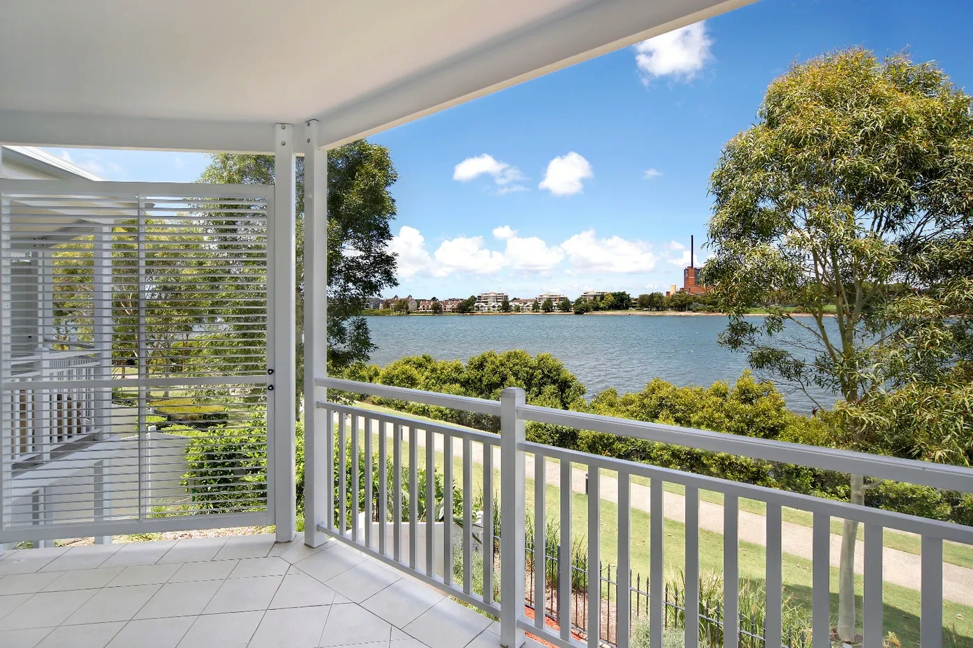 Covered balcony overlooking the river and parkland at a Westprecinct serviced residence in Cabarita