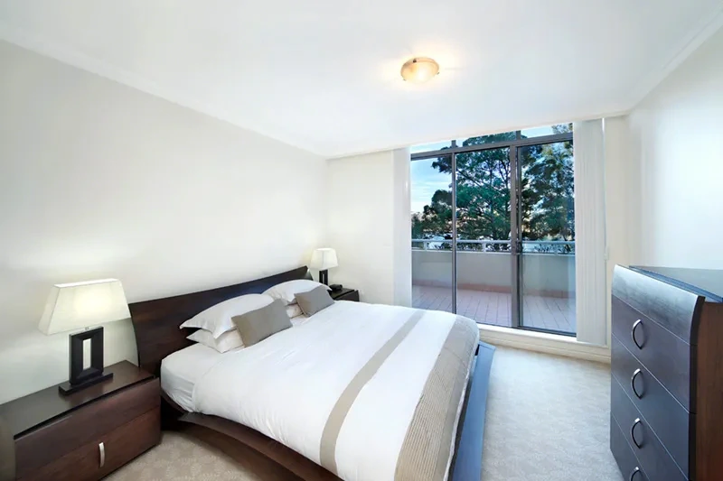 Serene master bedroom with water views