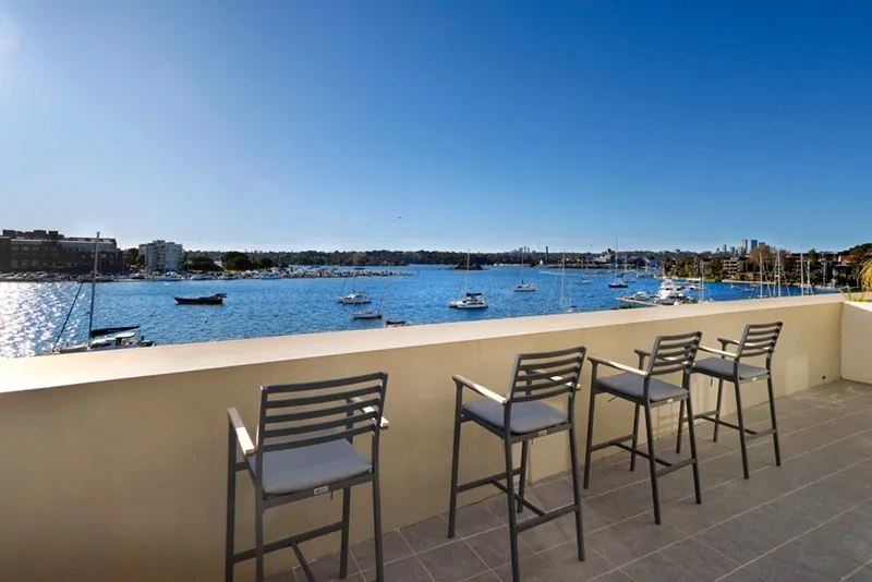 Elevated terrace seating with panoramic harbour views in Rozelle
