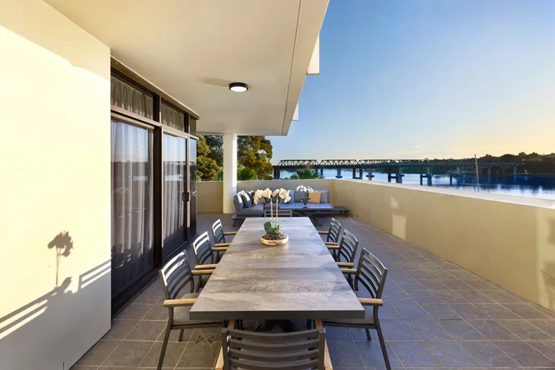 Alfresco dining on the terrace with water and bridge views