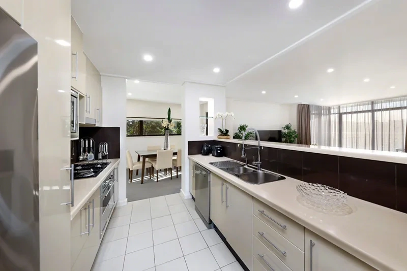 Quality kitchen with stone benchtops and stainless-steel appliances