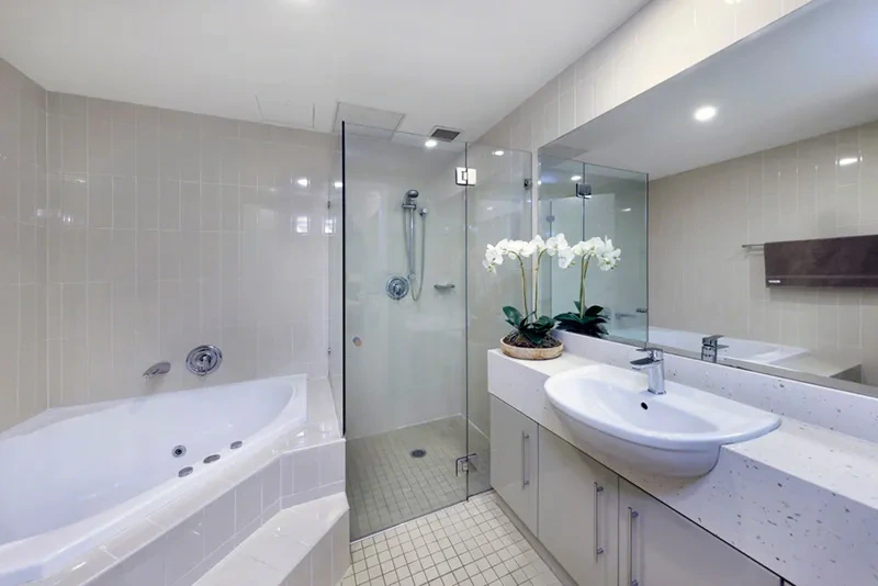 Stylish furnished bathroom with bath and separate shower