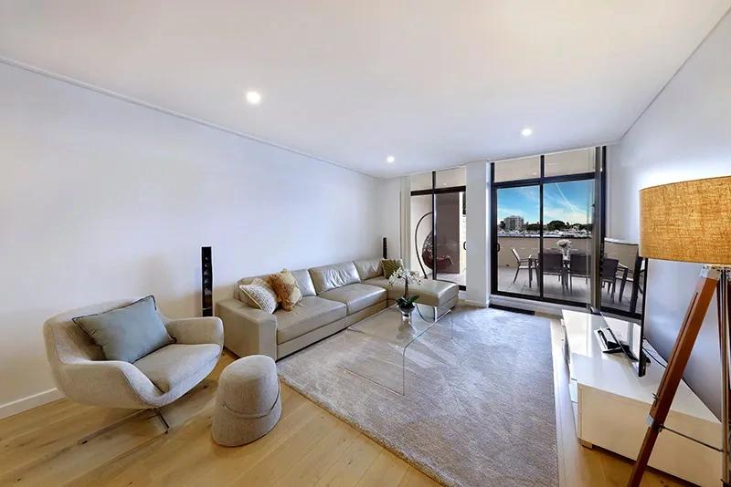 Fresh, modern furnished living area with terrace access