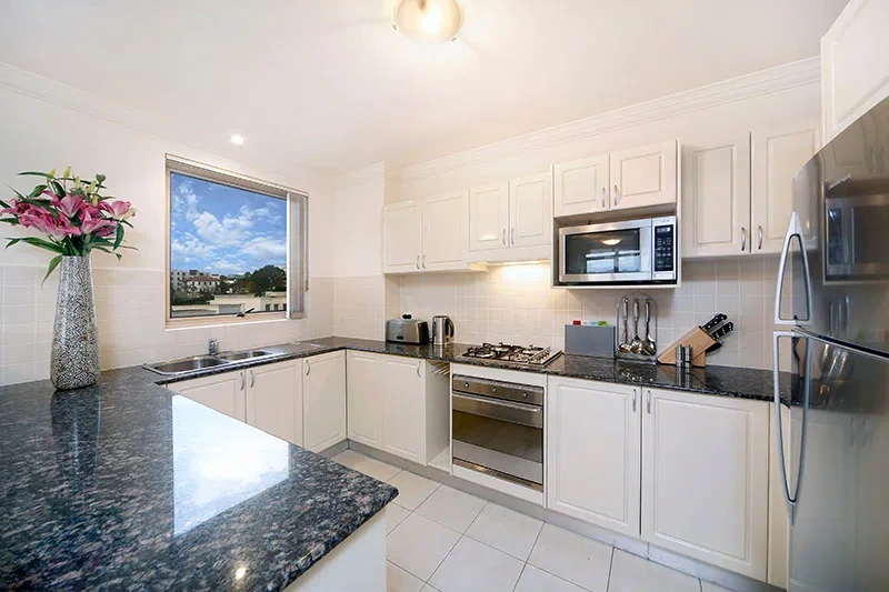 Kitchen with stainless-steel appliances and high-quality fittings
