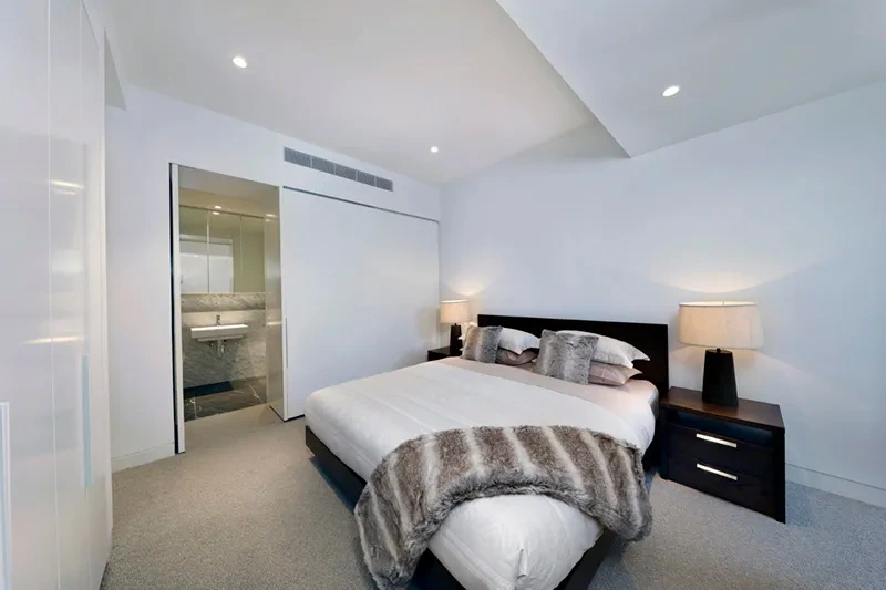 Furnished master bedroom in the Toorak residence