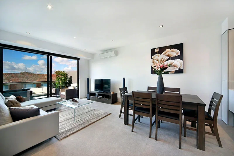 Open-plan living and dining in the Toorak penthouse